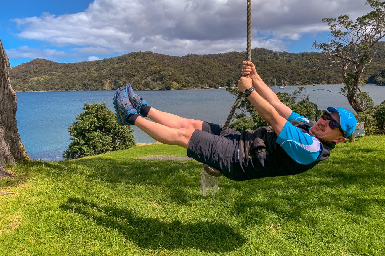 Kiwi Guide Andre swinging at Whangaparapara