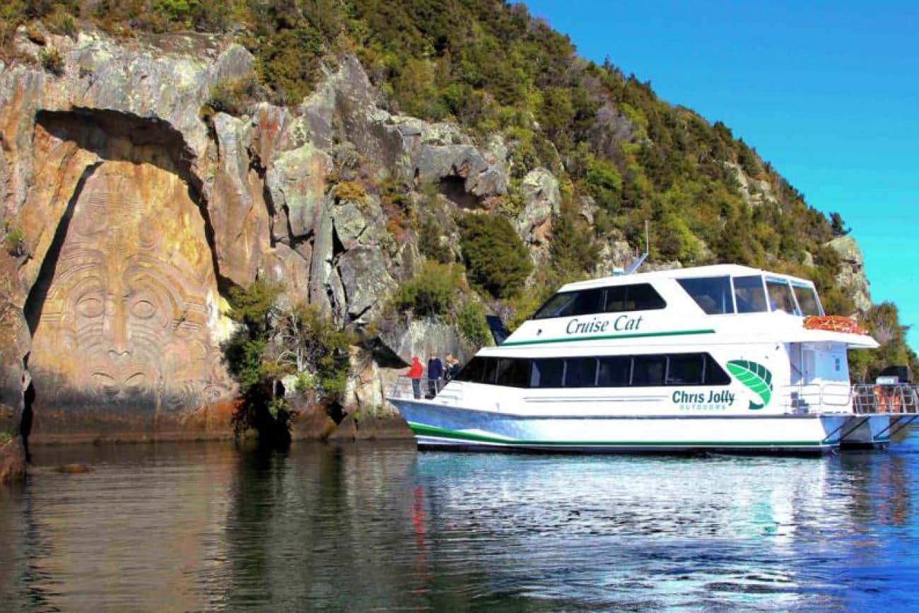 Cruise boat at the Mine Bay Maori Rock Carvings on Lake Taupo