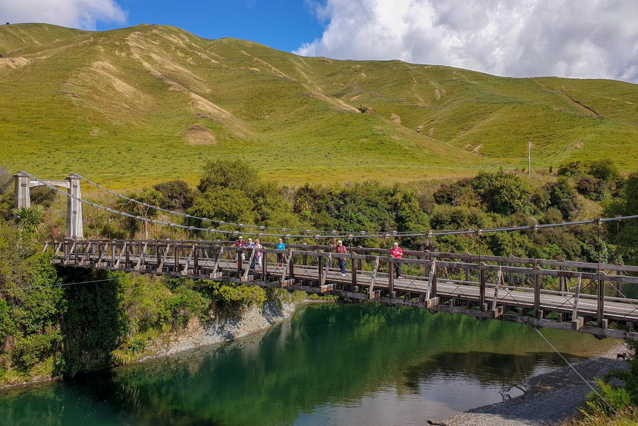 Crossing the Springvale Suspension Bridge on the Gentle Annie Road