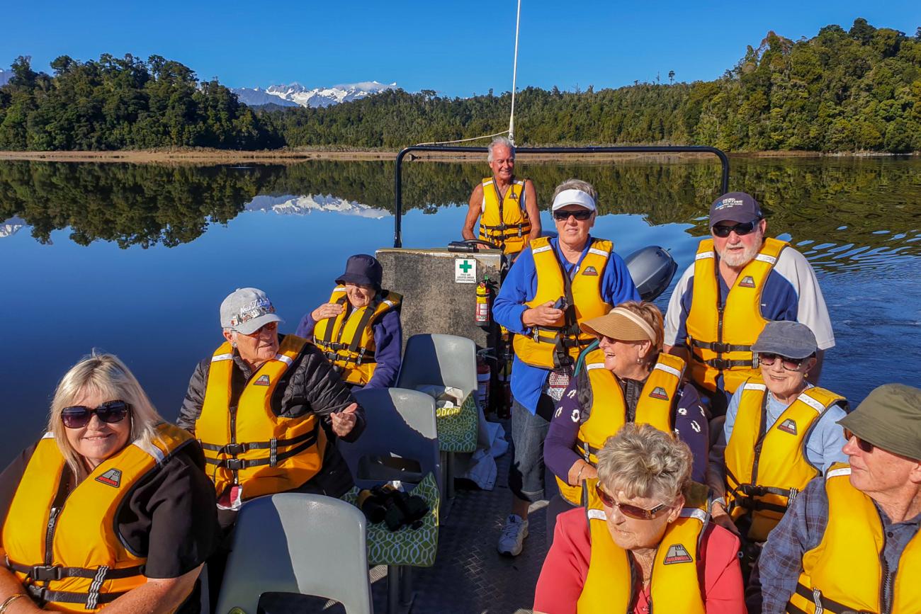 MoaTours group enjoying a wildlife cruise at Okarito