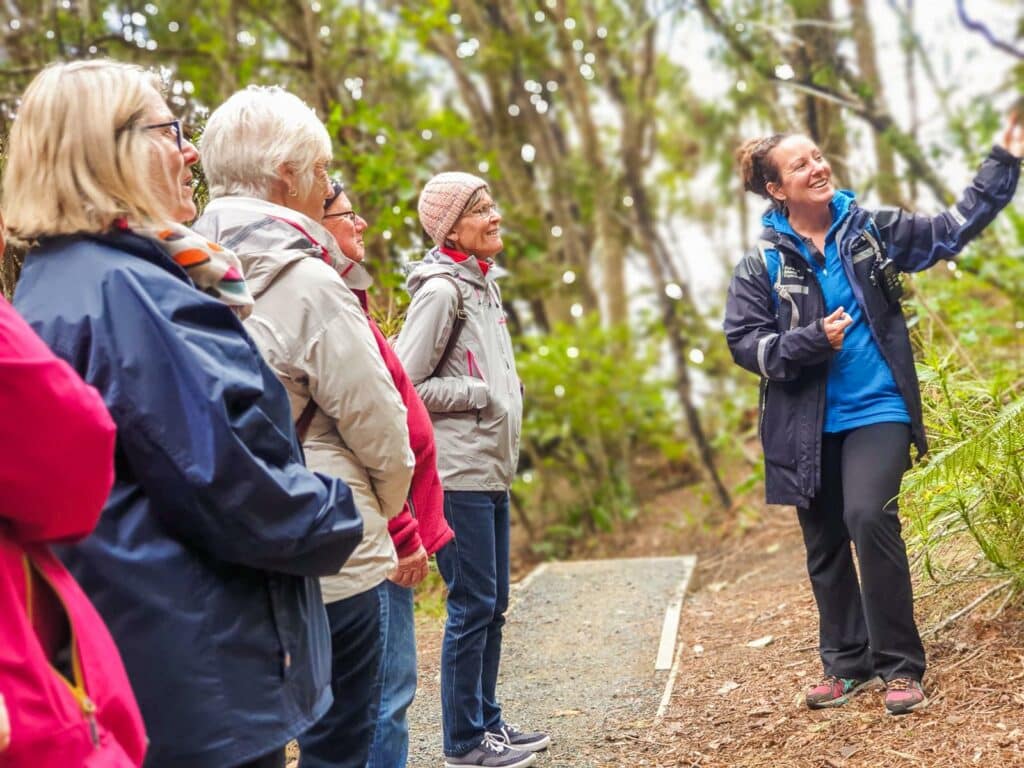 MoaTours guests and local guide on Ulva Island, Stewart Island