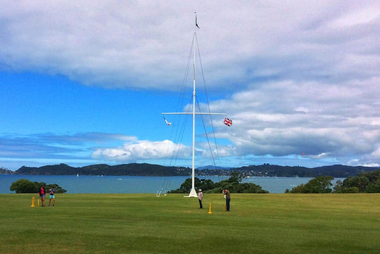 Flagpole flying three flags at Waitangi Treaty Grounds