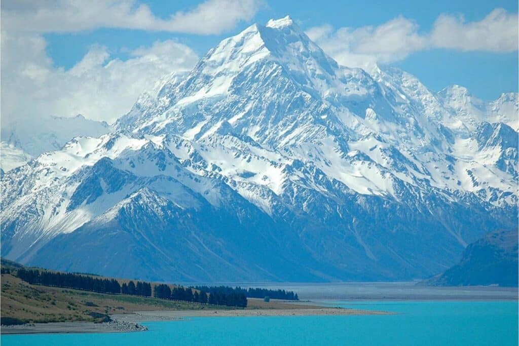 Aoraki 'the cloud piercer' snow covered mountain with lake in foreground