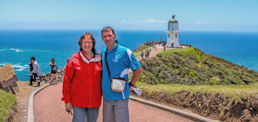 Kiwi Guide Sean and traveller at Cape Reinga