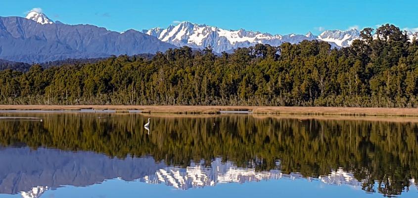 Reflections of the Southern Alps on Okarito Lagoon on the West Coast