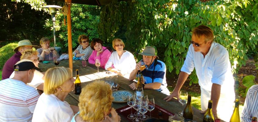 Guests and host Ian enjoying lunch in the garden at Akaunui in Canterbury