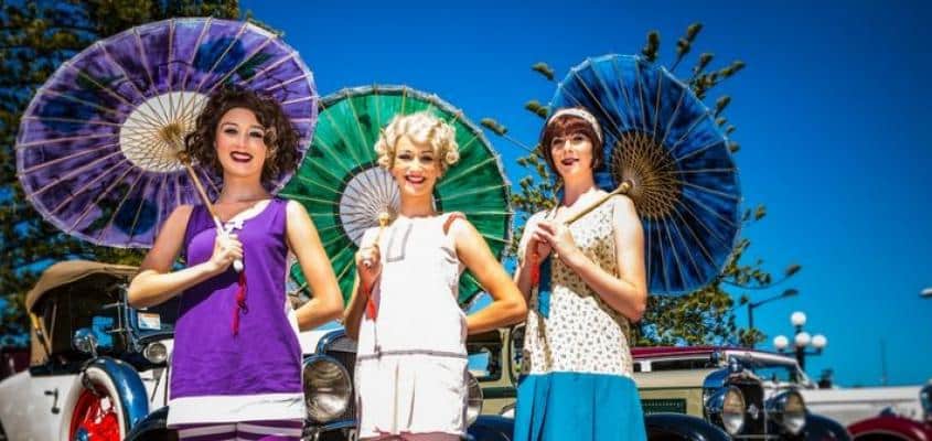 Ladies in Colourful Art Deco Dress and Vintage Cars at the Hawkes Bay Art Deco Festival