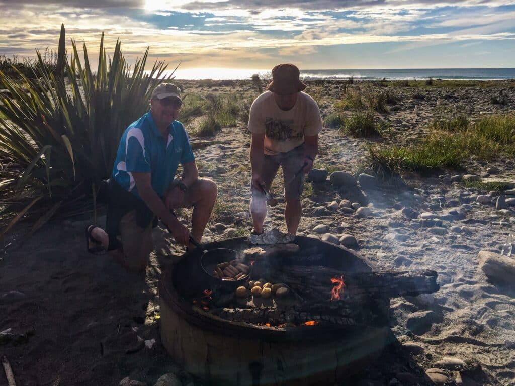 MoaTours guide Nigel BBQing on the beach in Punakaiki